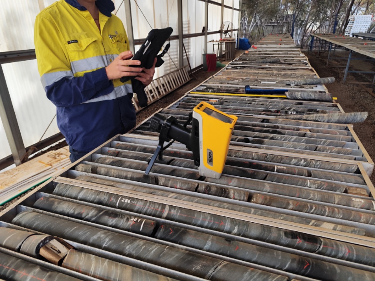 Geologist using tablet at drill core yard